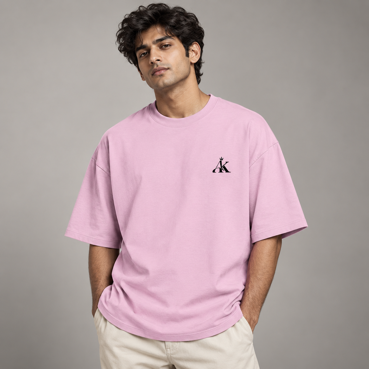 Man wearing AK Luxury Pastel Pink Unisex Oversized T-Shirt